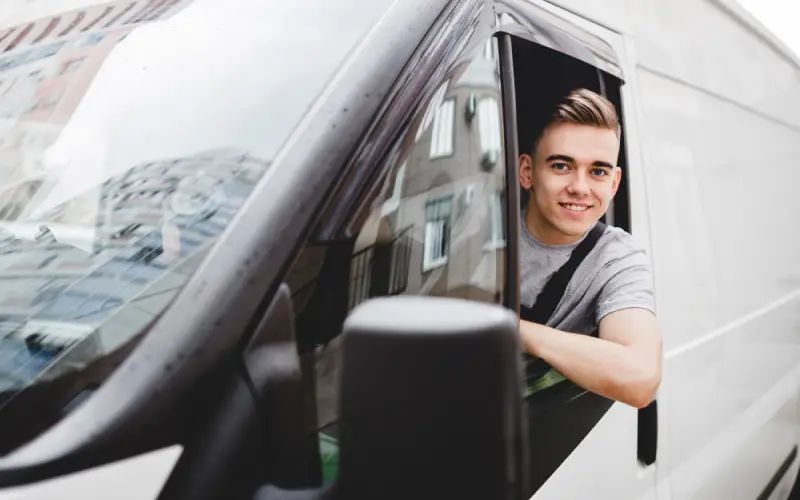 The Advantages of 24-Hour Locksmiths,A young man sits in the driver's seat of a white van